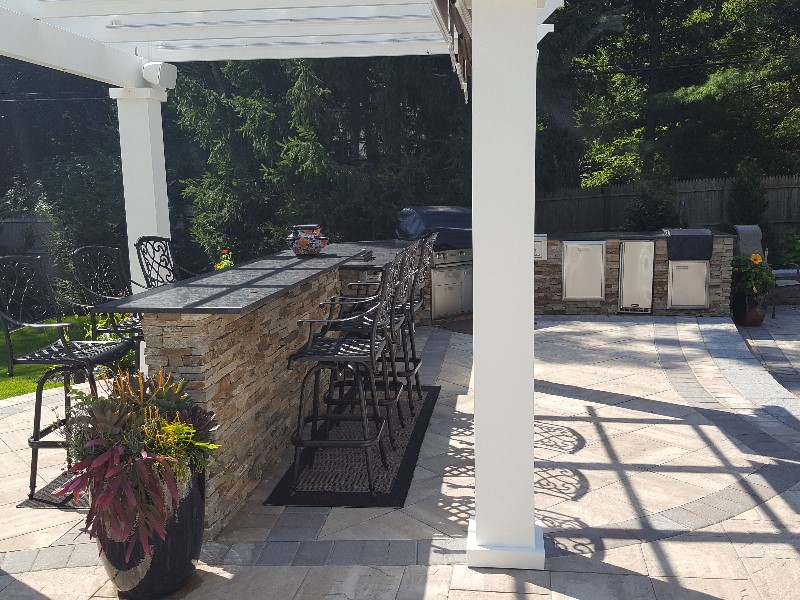 Outdoor kitchen with double faced bar